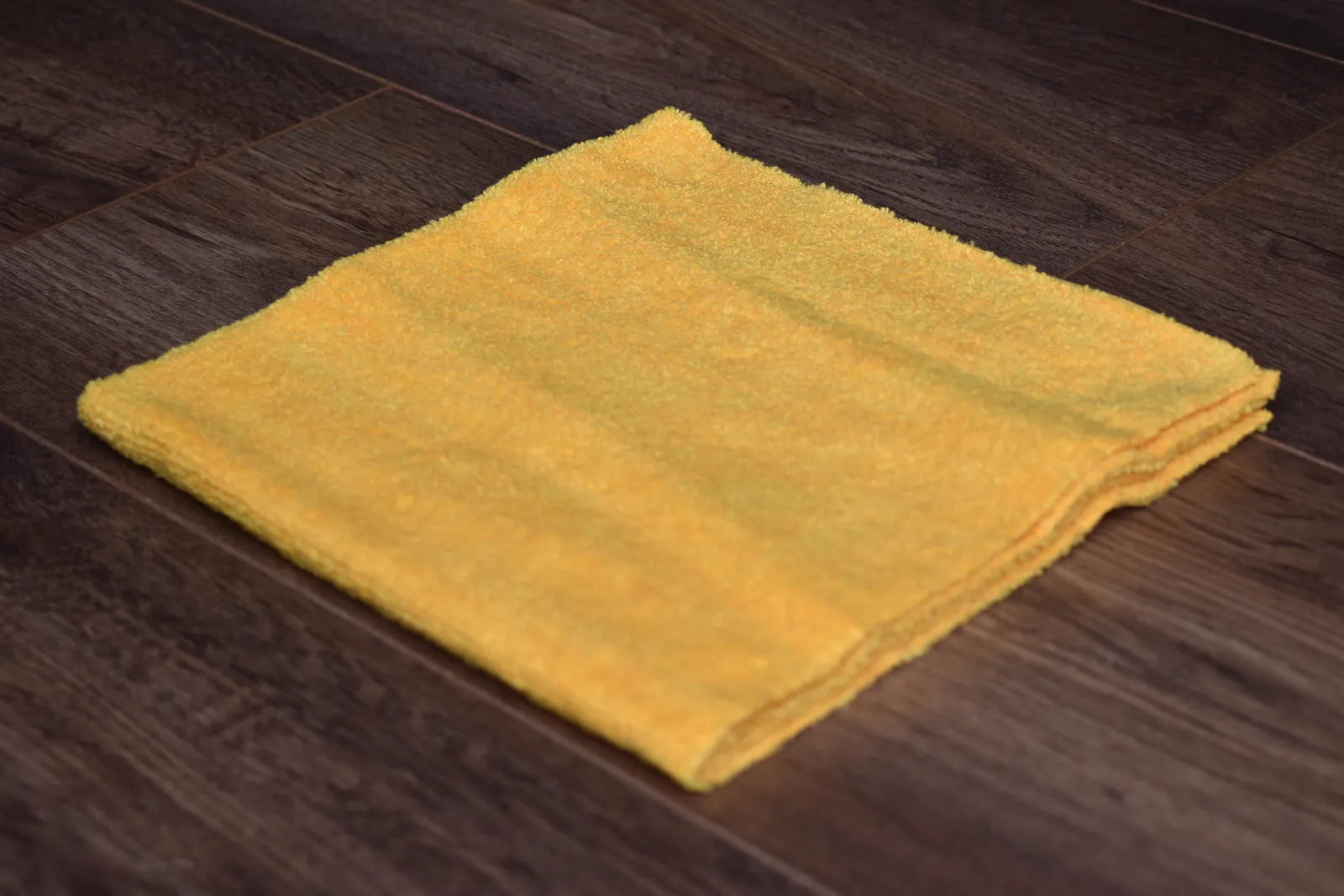 KHEMIA PLUS The Daily premium 365 GSM edgeless microfiber towel folded display - color golden yellow