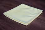Yellow microfiber cleaning towel folded - 300 GSM, 80/20 blend, 35x35 cm, stitched edge for home use
