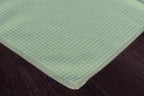 KHEMIA PLUS WAFFLE waffle-weave microfiber glass-cleaning towel — yellow corner laid flat showing waffle texture weave for streak-free glass cleaning