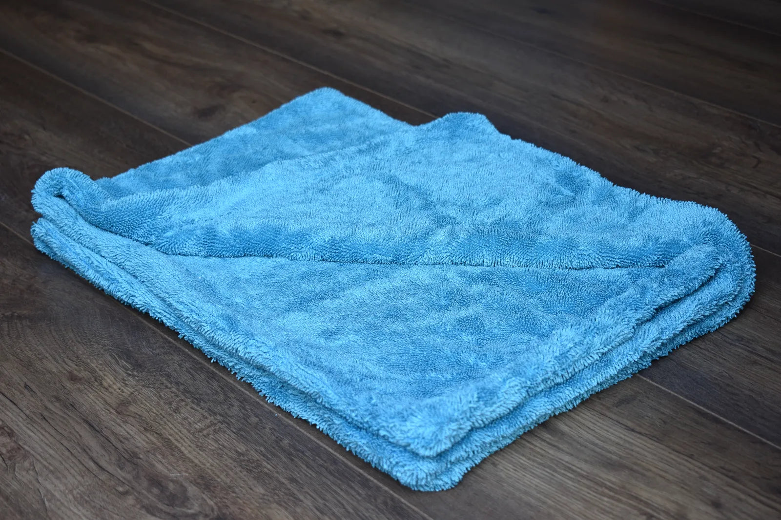 Aqua blue twist-loop microfiber close-up showing 1100 GSM dense fiber pile - 70/30 polyester polyamide blend