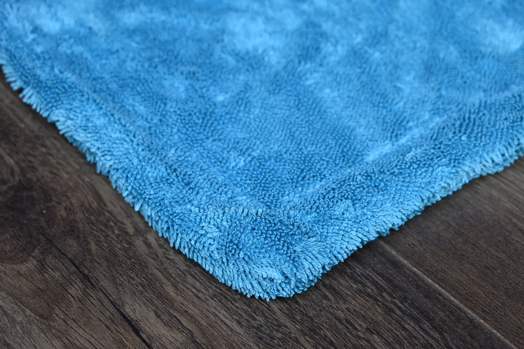 DRY-1100 medium variant showing dual-color sides - aqua blue and light grey twist-loop microfiber hemmed together