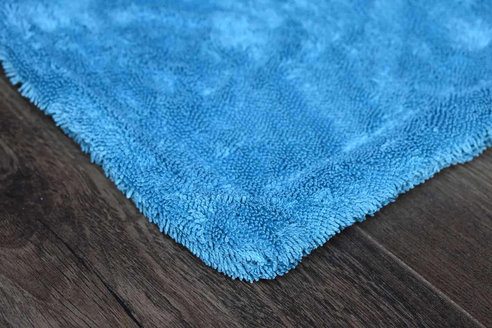 DRY-1100 medium variant showing dual-color sides - aqua blue and light grey twist-loop microfiber hemmed together