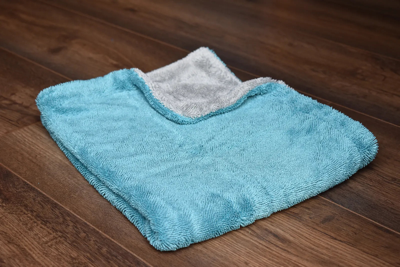 Light grey twist-loop microfiber close-up showing 1100 GSM dense pile texture