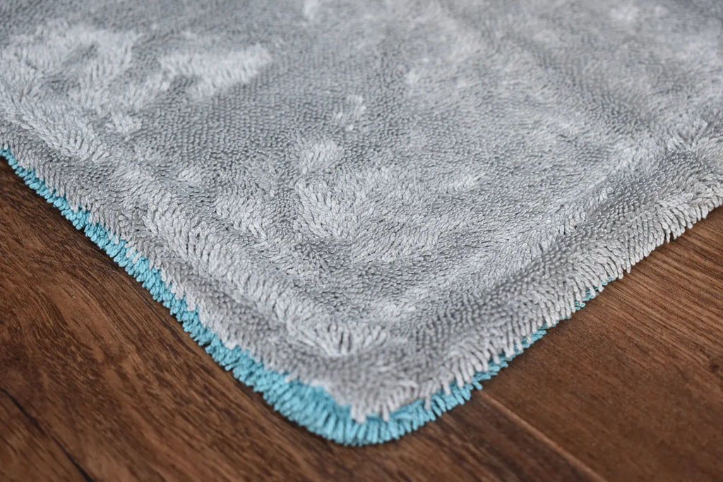 KHEMIA PLUS DRY-1100 1100 GSM dual-layer microfiber drying towel folded display - aqua blue side, twist-loop weave for car drying