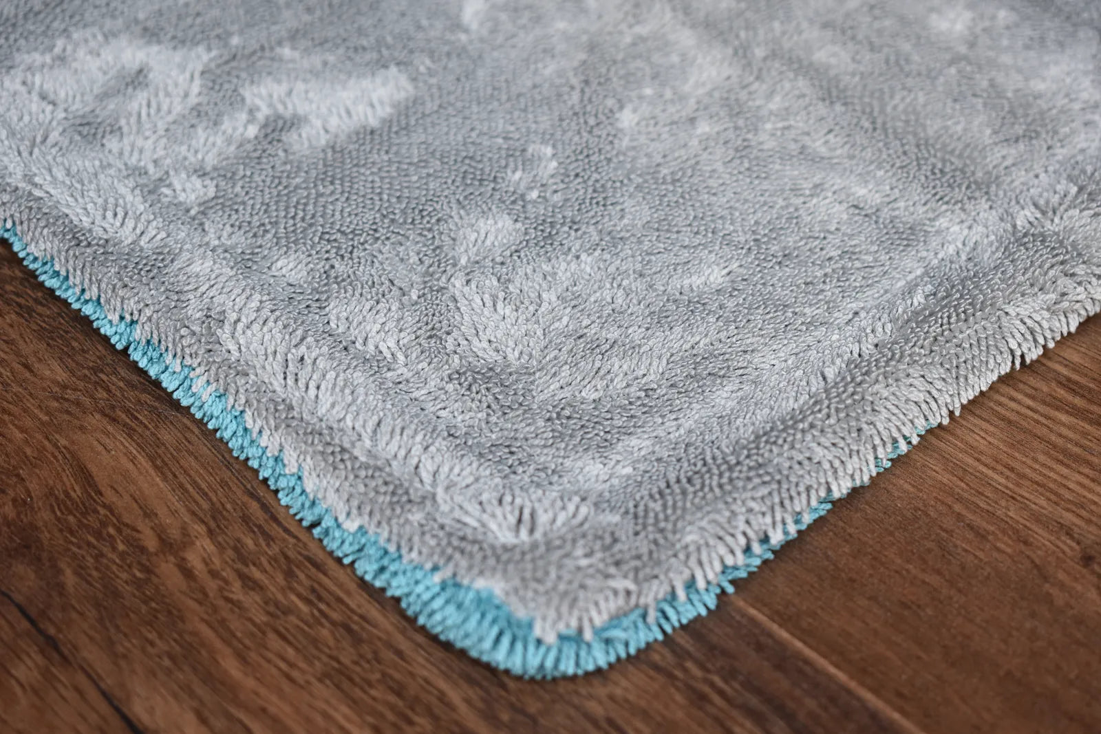 KHEMIA PLUS DRY-1100 1100 GSM dual-layer microfiber drying towel folded display - aqua blue side, twist-loop weave for car drying
