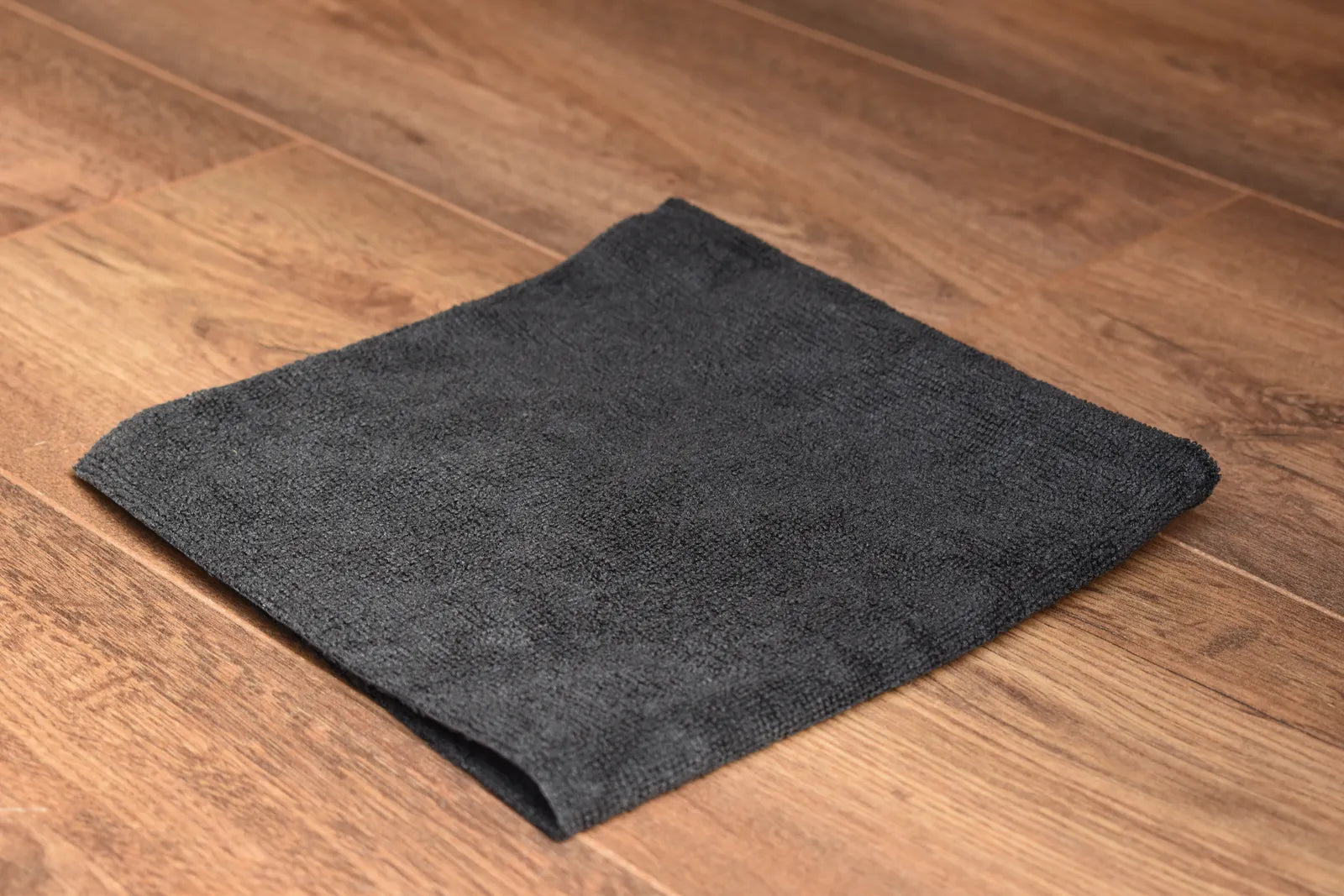 KHEMIA PLUS Light Terry 245 GSM edgeless microfiber towel folded display - color black