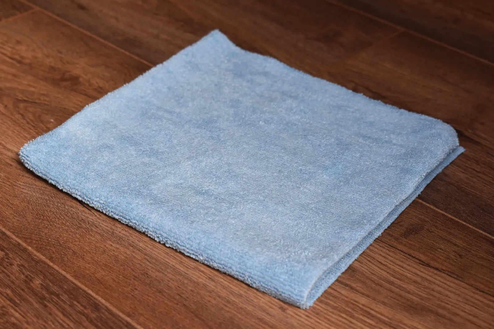 KHEMIA PLUS Light Terry 245 GSM edgeless microfiber towel folded display - color sky blue