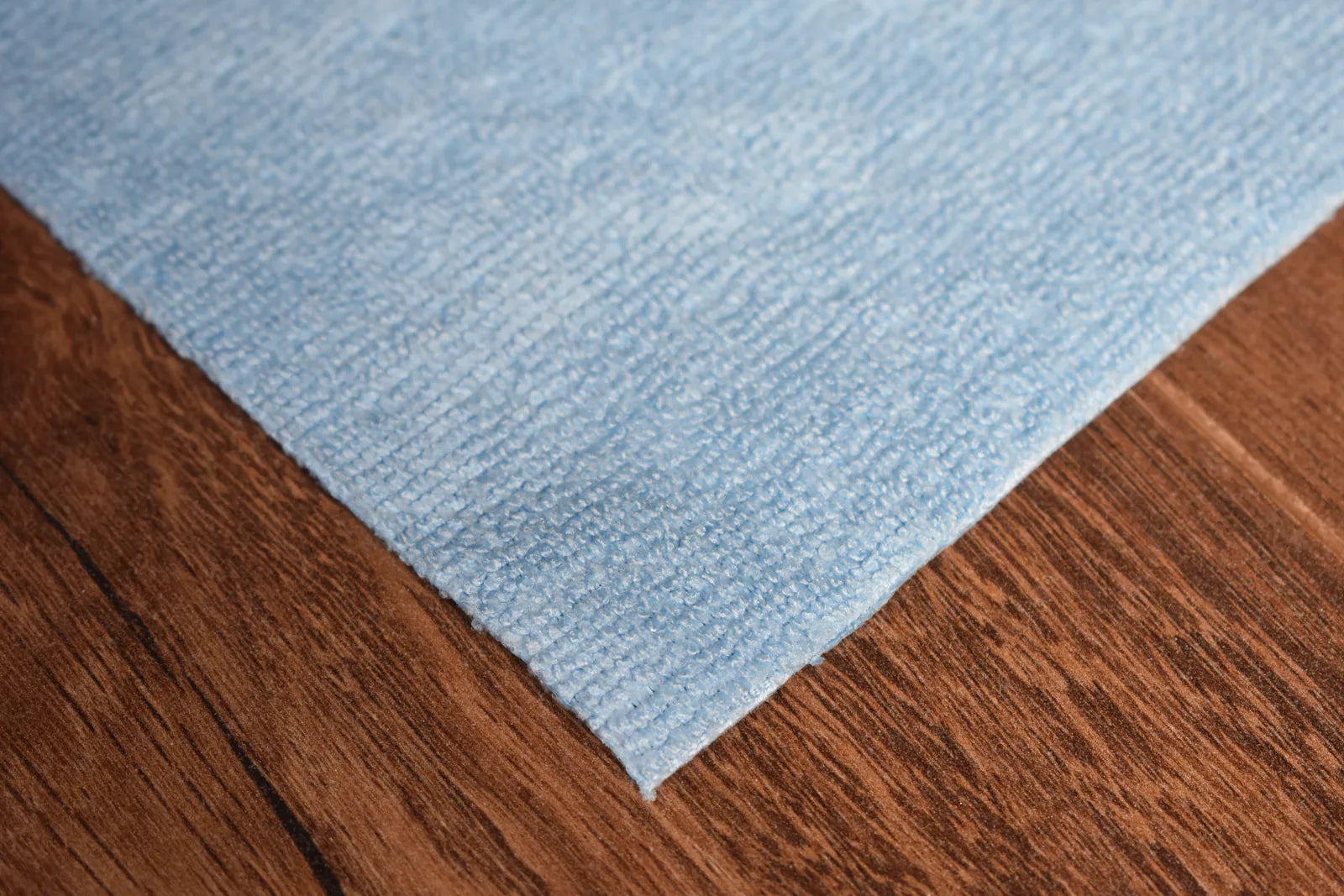 Light Terry sky blue microfiber towel close-up showing terry weave texture and edgeless edge